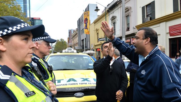 Taxi drivers and owners protest by blocking Bourke street