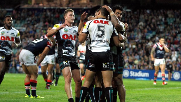 Upset: the Panthers celebrate during the dramatic finals win over the Roosters in 2014.