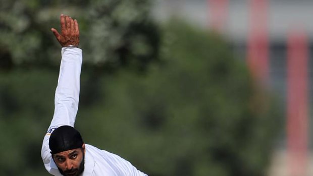 Monty Panesar gives the ball a mighty tweak during the tour match between England and a Pakistan Cricket Board XI.