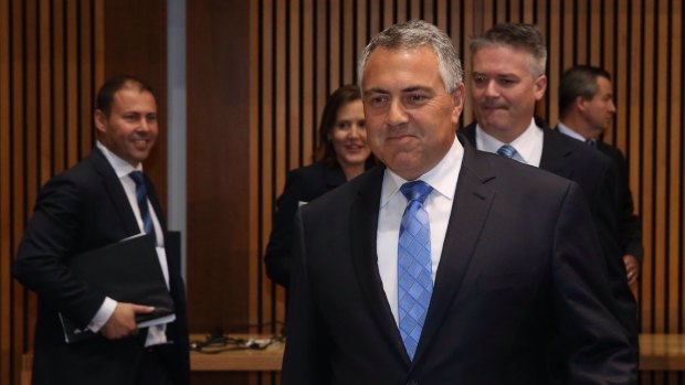 Tax cuts off the table: Treasurer Joe Hockey, with his frontbench team, at the release of the 2015 Intergenerational Report.