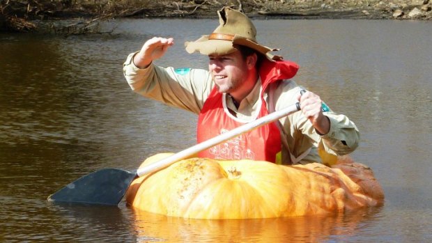 Tim the Yowie Man explores the Collector Creek in a pumpkin