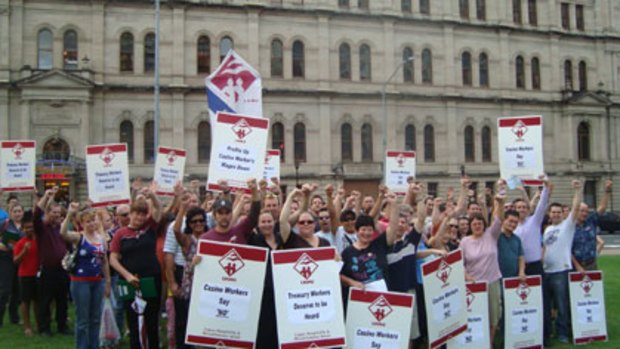 Casino workers rally outside the Conrad Treasury Casino to demand a larger pay rise than the 3 per cent offered by the company.