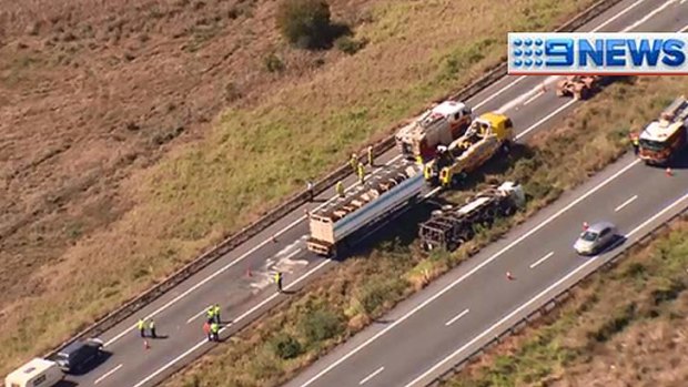Emergency crews clean up after a crash on the Gateway Motorway.