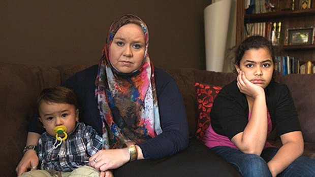 Jennifer Birrell in Melbourne with two of her five children, Ahmed, 1, and Jamilla, 11. Her other three children are in Riyadh.