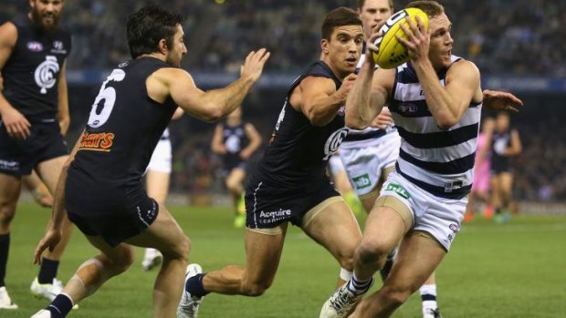 Any which way: Geelong's Joel Selwood leads the Blues on a merry dance.
