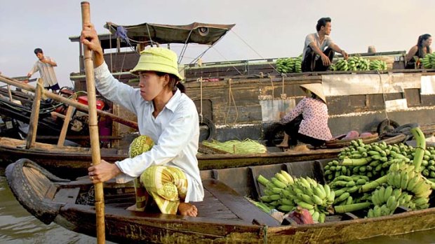 Silver scene ... floating markets are among Vietnam's maritime traffic.