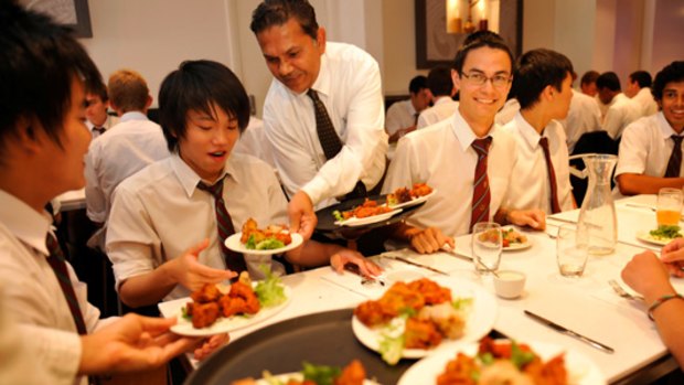 James Khare of Little India restaurant serves Melbourne High School students on Vindaloo against Violence day.