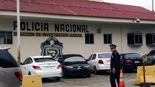 A policeman satnds in front of the National Police of Panama headquarters in Panama City.