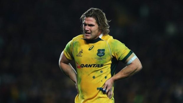 Tough night: Michael Hooper trudges off following the heavy Bledisloe Cup loss to New Zealand.