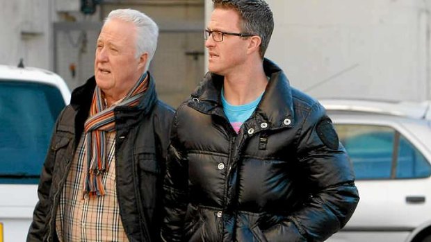 Michael Schumacher's father Rolf, left, and brother Ralf arrive at Grenoble Hospital.