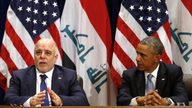 Confusion: Iraqi PM Haider al-Abadi, left, stunned American reporters by informing them that Iraq had "credible" evidence that the Islamic State planned to bomb New York.