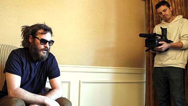 Joaquin Phoenix films a scene with Casey Affleck behind the camera.