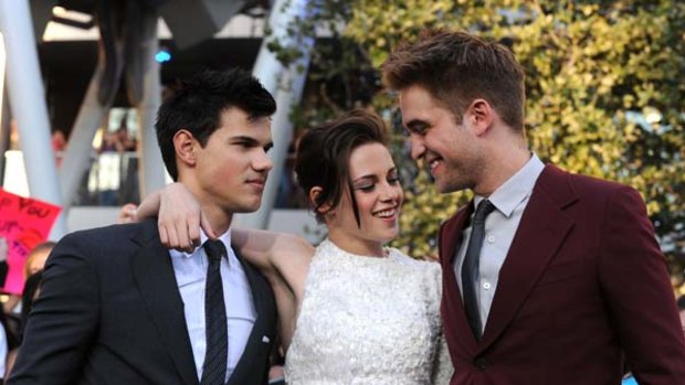 Laughing all the way to the bank ... Taylor Lautner, Kristen Stewart and Robert Pattinson.