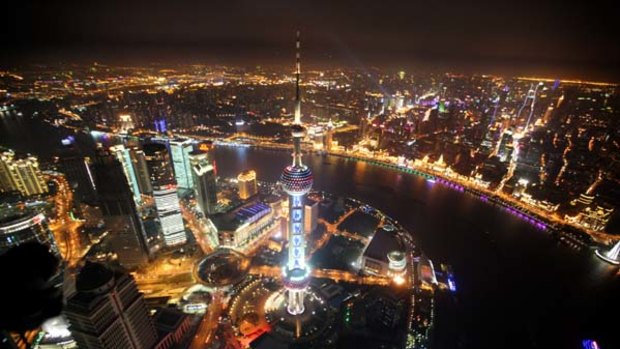 On the waterfront ... Shanghai's new financial district skyline along the Huang Pu river.