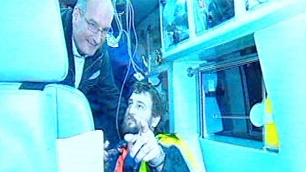 Becoming the story ... David Koch jumped on board the ambulance at Beaconsfield with rescued miner Todd Russell.