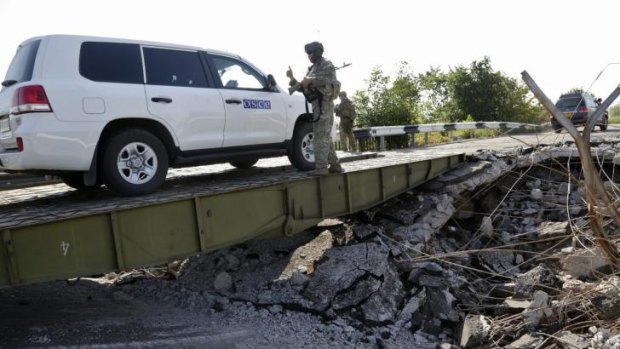 International forensic experts and members of the OSCE mission in Ukraine travel to the crash site on Sunday.
