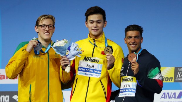 Silver medalist Mack Horton on the podium with gold medalist Yang Sun.
