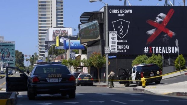 Shooting scene" Police lines are set up outside the 1OAK club in West Hollywood on Sunday.