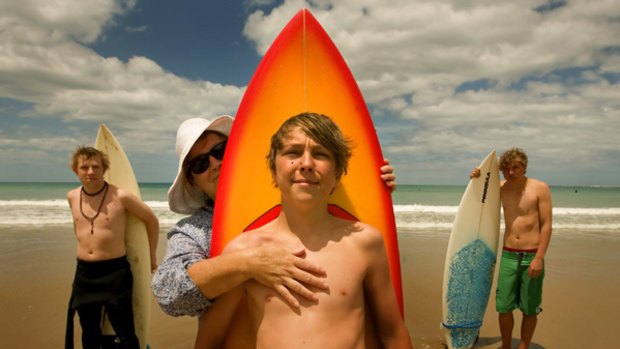 Sons, surf and sand: (from left) Declan, Margaret, Jed and Sean on the main beach at Lorne.