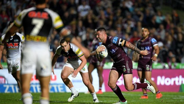 On the burst: Manly player Curtis Sironen makes a break to score against the Panthers.