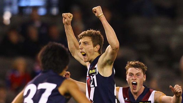 Fletcher Roberts celebrates after kicking a goal.