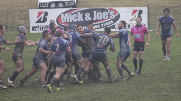 Goulburn and Belconnen players brawl at the end of Sunday’s match.