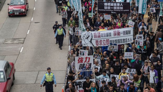 People take part in a rally on January 10 in Hong Kong, protesting the disappearance of five Hong Kong booksellers.