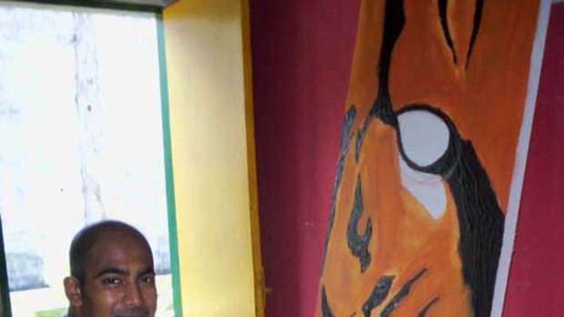 Myuran Sukumaran with one of his paintings. <i>Amilia Rosa</i>