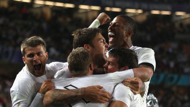 'Tournament rugby' ... England celebrate their dramatic win over Scotland.