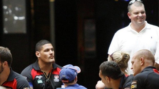 Newcastle Knights players with Hunter Sports Group owner Nathan Tinkler (standing).