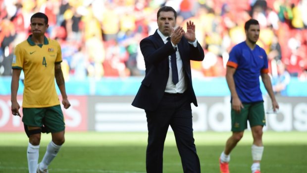 Beaten but unbowed: Tim Cahill and Ange Postecoglou after the Socceroos' 3-2 defeat to the Netherlands.
