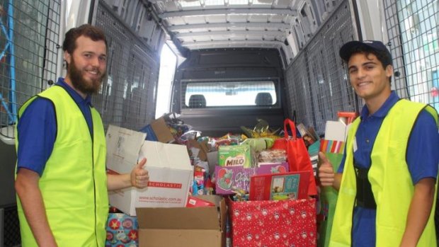 Vinnies volunteers Brett and Rowan are among those lending a hand this festive season.