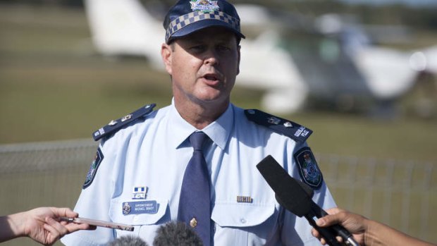 Police superintendent Michael Brady speaks to media after a light plane crash at Caboolture airfield. 22nd of March 2014. Photo: Harrison Saragossi