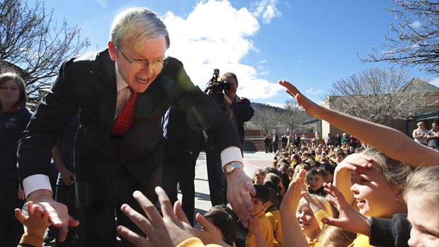 Kevin Rudd, during his time as PM,  being welcomed by students from Gordon Primary School in the ACT.