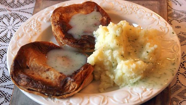 Two pies, mash and parsley liquor.