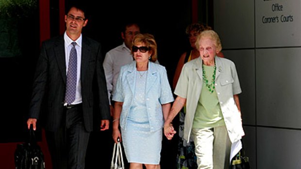 Ann Kramer (centre) leaves the Melbourne Coroner's Court yesterday hand-in-hand with her aunt, Joan Keating, and flanked by lawyer Steve Schembri.