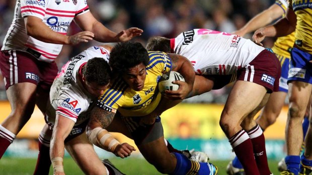 Fuifui Moimoi of the Eels is tackled.