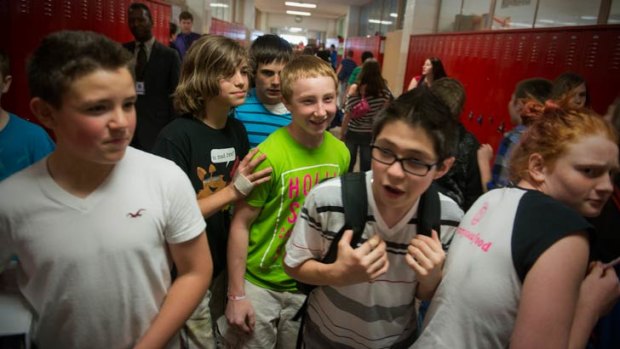 Jake Schellenschlager jokes with school friends.