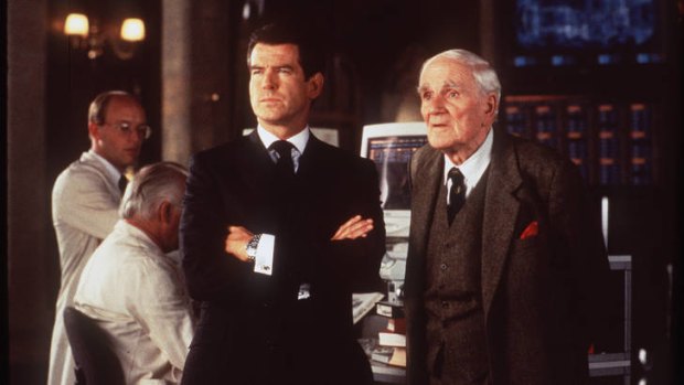 Pierce Brosnan as Bond and Desmond Llewellyn as Q in <i>The World Is Not Enough</i>.