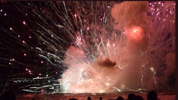 Crowds were evacuated from Terrigal Beach on the Central Coast after a barge carrying fireworks caught alight during the 9pm show.