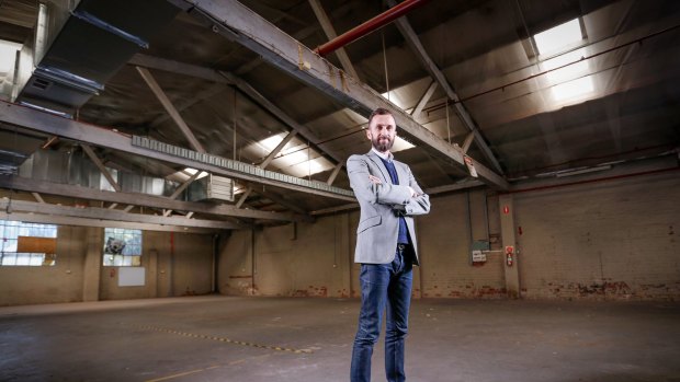  Artbank Director Tony Stephens inspects the artwork-lending agency's new warehouse in Collingwood.  