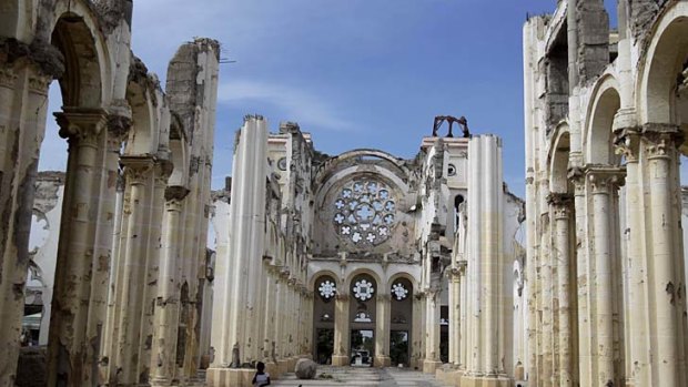 Much of the damage from Haiti's earthquake in January 2010, such as the cathedral in Port-au-Prince, remains as countries fall behind in their aid commitments.