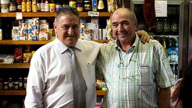 Adios ... Manuel Villarino, co-owner of the iconic Capitan Torres restaurant, with deli manager Ramon Reqeuiro.