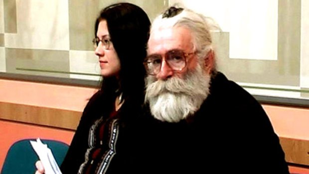 Disguise ... Radovan Karadzic posing as a doctor of alternative medicine called Dr Dragan David Dabic while attending a medical lecture.