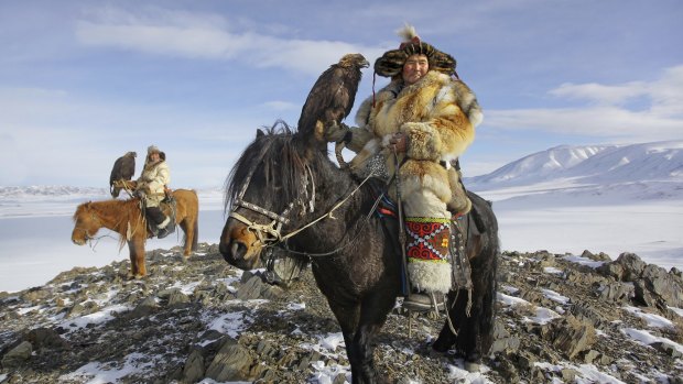 Epic Kazakh Golden Eagle hunters on horseback.
