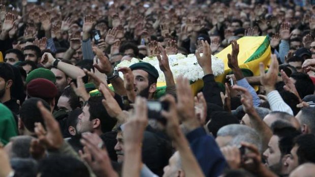 Relatives and Hezbollah members carry the coffin of one of the victims killed during suicide bombings near Iran's embassy compound in Beirut.