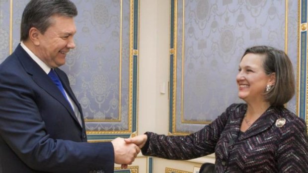 Ukraine's President Viktor Yanukovych, left, greets US Assistant Secretary for European and Eurasian Affairs Victoria Nuland  in Kiev.