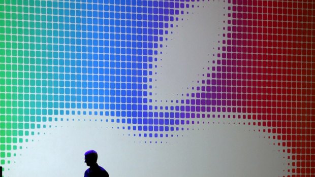 Apple CEO Tim Cook walks off stage after speaking during the Apple Worldwide Developers Conference in San Francisco.