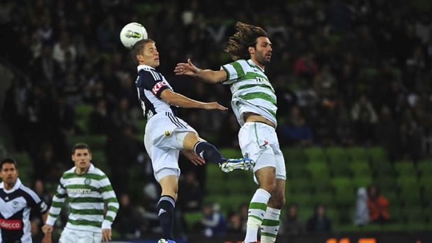 Up in the air: Melbourne Victory's Adrian Leijer and Georgios Samaras of Celtic go for the ball during last night's clash.