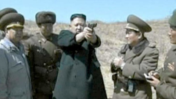 North Korean leader Kim Jong-un shows off his pistol skills.
